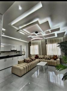 a large living room with couches and a table at Massira 2 in Taza
