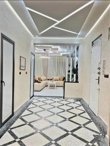 a living room with a couch and a table at Massira 2 in Taza +1 photo