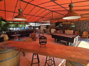 a bar with a ping pong table and a pool table at Chalet 4 Pers - Terrasse - API-1-52-1751 in Espira-de-Conflent