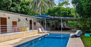 a house with a swimming pool and a swing at casa Lucerna in Prado