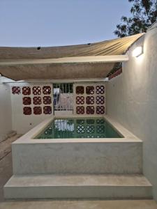 a swimming pool on the side of a house at Merida Centro House with Private Pool and Air Conditioning in Mérida
