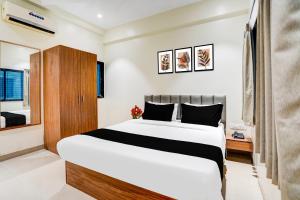 a bedroom with a large bed in a room at Collection O Shendra MIDC Aurangabad Formerly Sai Palace in Aurangabad
