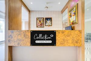a sign for a restaurant on a counter at Collection O Shendra MIDC Aurangabad Formerly Sai Palace in Aurangabad