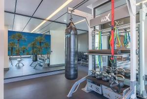 a room with a gym with a lot of equipment at Volar Luxurious #328 in Los Angeles