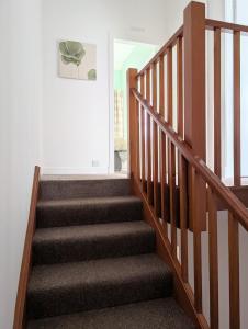 a staircase in a home with a stair case at Argyll Place in Campbeltown