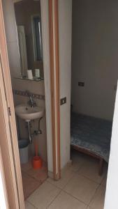 a bathroom with a sink and a mirror at Panoramic 3-Bedroom Chalet with Terrace-Garden in Kfardebian +8 photos