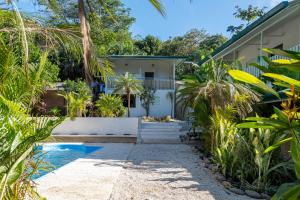 a view of a house from the garden at KAIA VILLAGE, Santa Teresa, Costa Rica in Santa Teresa Beach