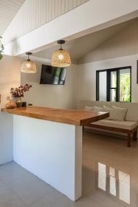 a living room with a table and a couch at KAIA VILLAGE, Santa Teresa, Costa Rica in Santa Teresa Beach