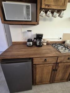 a kitchen with a blender on top of a counter at Casa Luna TX in Tequisquiapan +7 photos