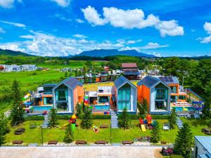 a house with a large yard with a playground at MK Land Pool Villa Khaokho in Khao Kho
