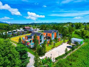 an aerial view of a town with colorful houses at MK Land Pool Villa Khaokho in Khao Kho