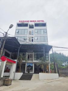 a hotel with a sign that reads kabaseka ninja hotel at Ha Giang Numa Hotel in Ha Giang