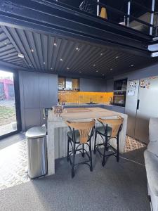 a kitchen with a large kitchen island with stools at Villa Baraka in İznik
