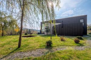 a black building with a tree in front of it at Villa Baraka in İznik