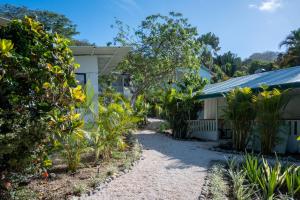 a garden in front of a house at KAIA VILLAGE, Santa Teresa, Costa Rica in Santa Teresa Beach
