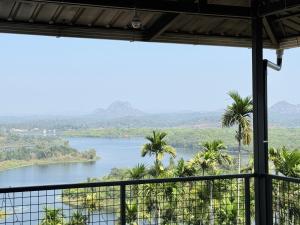 a view from a room with a view of a river at Valensa lake view in Kalpetta