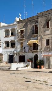 an old building with windows and balconies at Casa Calamondino in Bari