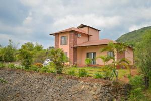 a house on the side of a hill at Lifeline Villas - Horizon Backwater Luxe Infinity Pool Villa in Mahabaleshwar