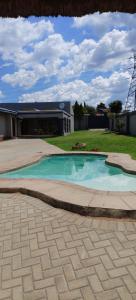 a small blue pool in front of a building at Executive en-Suite - Southgate in Southgate