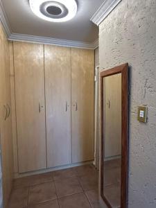 a room with white cabinets and a ceiling at Executive en-Suite - Southgate in Southgate