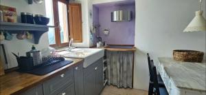 a kitchen with a sink and a counter top at Agave di mare in Riomaggiore