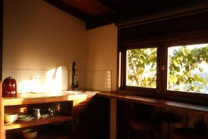 a kitchen with a counter and a window in it at SIA Home - Dalat Haus in Ấp Ða Lợi