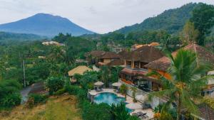 an aerial view of a resort with a mountain at Villa Karma Loka in Sidemen