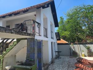 a white house with a balcony and a patio at Vila Darkoni2 in Bijeljina +10 photos