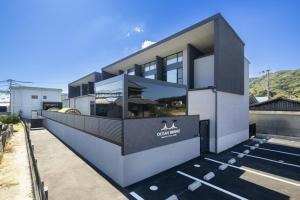 a large building with a sign in a parking lot at Ocean Bridge - Vacation STAY 76453v in Awaji