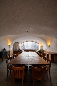 a large dining room with a large table and chairs at Splendid ski-in,ski-out historical chalet! in La Lechere