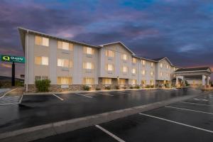 a hotel parking lot in front of a building at Quality Inn near Monument Health Rapid City Hospital in Rapid City