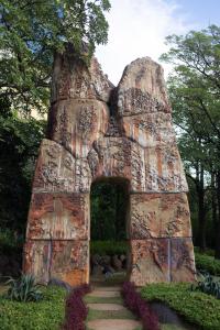 a rock house in the middle of a garden at Hyatt Regency Chennai in Chennai