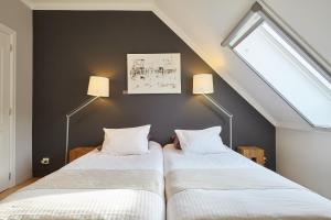Voodi või voodid majutusasutuse B&B Zinnen en Minnen toas