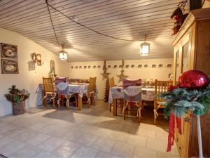 a dining room with tables and chairs in a room at Gästehaus Barbara Schwaiger - Chiemgau Karte in Inzell