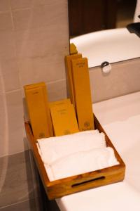 a wooden tray of soap sitting on top of a bath tub at Semari Resort in Muzaffarabad +24 photos