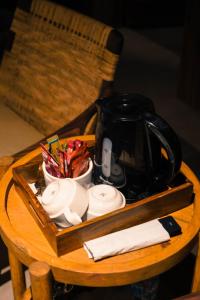 a tray with a tea pot and cups on a table at Semari Resort in Muzaffarabad