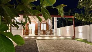 a rendering of a house at night at Noel Villa in Galle