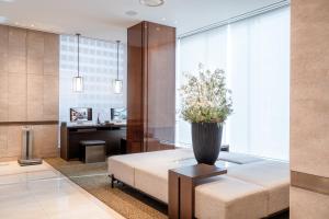 a living room with a couch and a table at Crown Park Hotel Seoul Myeongdong in Seoul