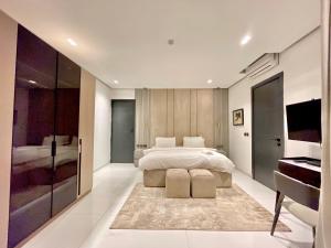 a bedroom with a bed and a bedroom with a piano at 2 Bedroom in Lekki phase 1 in Mama