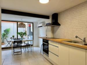 a kitchen with a sink and a counter top at Casa Borguny - House in the centre of Palma in Palma de Mallorca