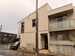 a building on the corner of a street at Franmare in Okayama