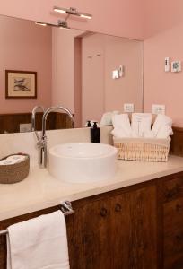 a bathroom with a sink and a mirror at Casa Gugù Room & Breakfast in Ravenna +86 photos