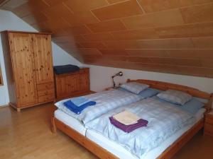 a bedroom with a large bed in a attic at Haus Pfatschbacher in Wildalpen
