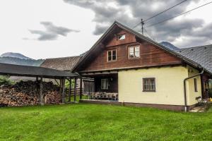 a house with a grass yard in front of it at Haus Pfatschbacher in Wildalpen