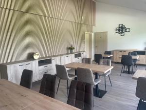 a dining room with a table and chairs at Le Grand Pont in Vielsalm