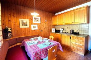 a kitchen with a table with a table cloth on it at Almliesl THUR-746 in Lovara