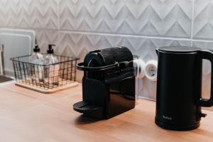 a coffee maker is sitting on a counter at STRIĶU15 - Plašs studio dzīvoklis in Saldus