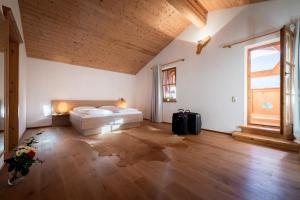 a large room with a bed and a window at Ferienhaus-Pitztal in Wenns