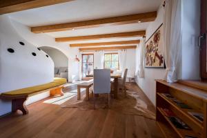 a room with a table and a dining room at Ferienhaus-Pitztal in Wenns +27 photos