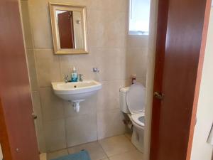a bathroom with a toilet and a sink at Akkerdam Bed and Breakfast in Calvinia +27 photos
